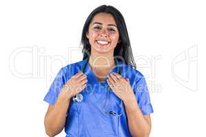 Smiling doctor with her hands holding her stethoscope