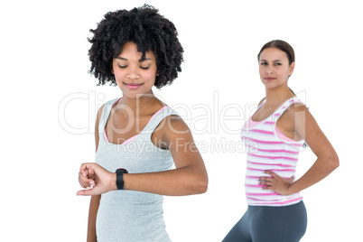 Fit woman checking wristwatch