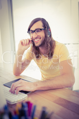 Hipster smiling while using headphones