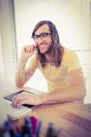 Hipster smiling while using headphones