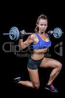 Confident female bodybuilder lifting crossfit