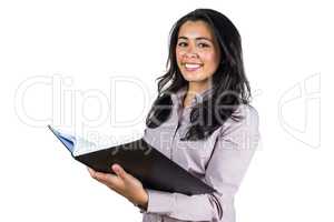 Businesswoman looking at a business ledger