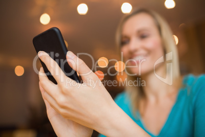 Happy young woman with mobile phone