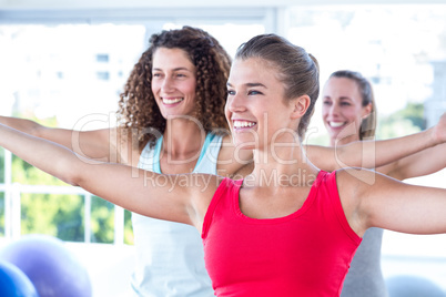 Cheerful women with arms outstretched Cheerful women with arms outstretched