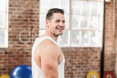 Smiling muscular man in crossfit