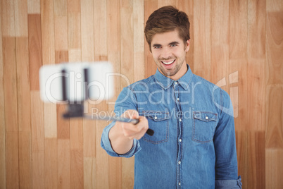 Hipster taking selfie in office