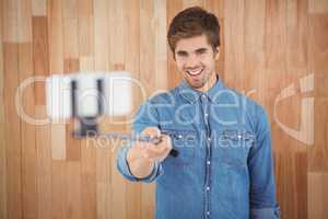 Hipster taking selfie in office