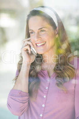 Happy woman talking on cellphone Happy woman talking on cellphone