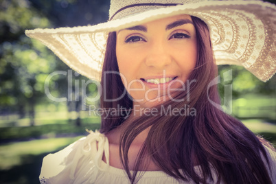 Portrait of smiling woman in sun hat
