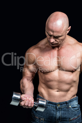 Bald man exercising with dumbbells