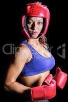 Portrait of pretty boxer with headgear and gloves