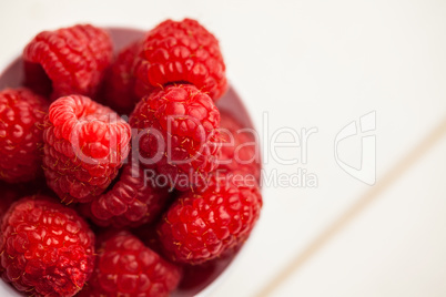 Portion cup of fresh raspberries