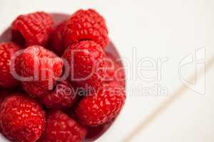 Portion cup of fresh raspberries