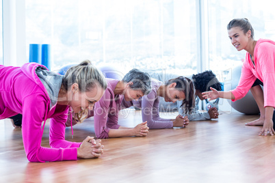 Group of women exercising on floor