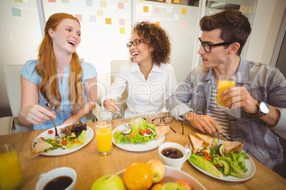 Happy business people having lunch