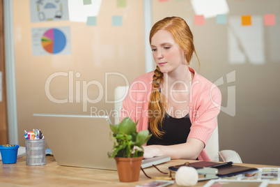 Thoughtful businesswoman working at office