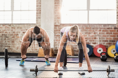 Two fit people working out