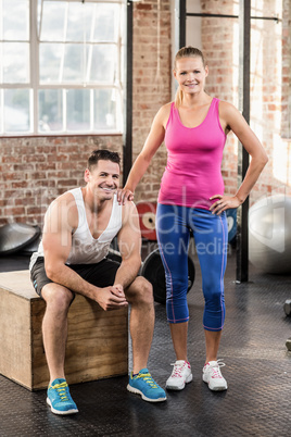 Standing and sitting muscular couple