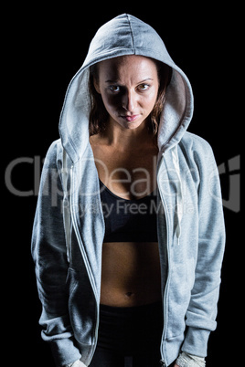 Portrait of female athlete in hood