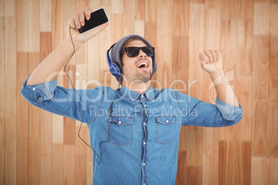 Hipster wearing sunglasses enjoying music