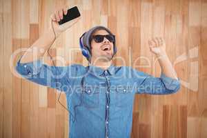 Hipster wearing sunglasses enjoying music