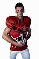 Portrait of rugby player posing with helmet