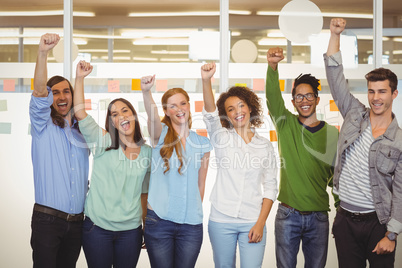 Excited business people with arm raised