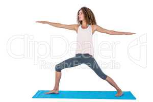 Young woman exercising with arms outstretched