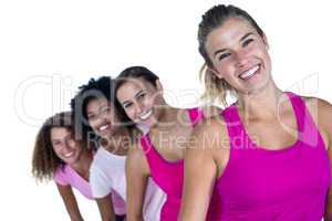 Portrait of happy women standing in row