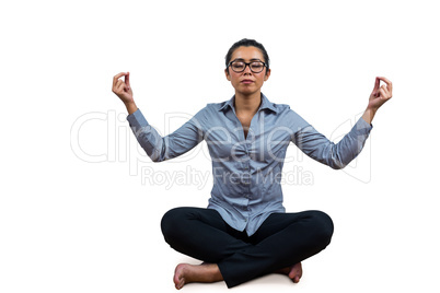Woman meditating with her legs crossed