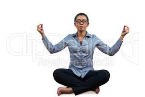 Woman meditating with her legs crossed