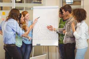 Business people looking at whiteboard