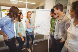 Businesswoman discussing with colleagues in meeting