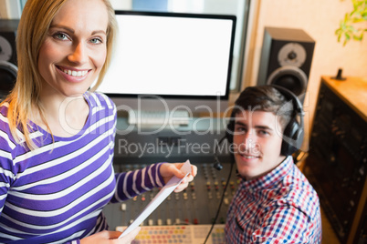 Portrait of female employee with male radio host