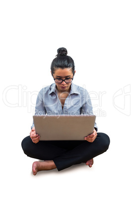 Smiling businesswoman using her laptop