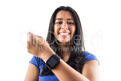 Smiling woman showing off her smartwatch