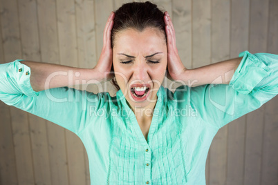 Woman with eyes closed while suffering from headache