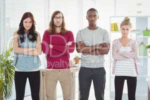 Portrait of business team with arms crossed while standing in a