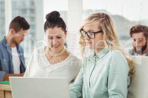 Businesswomen working on laptop