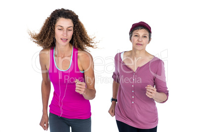 Determined women jogging