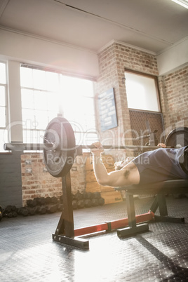 Cropped image of man holding barbell