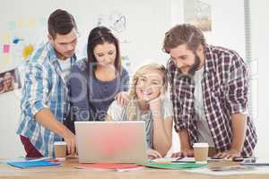 Colleagues working on laptop