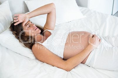 High angle view of woman grimacing in pain