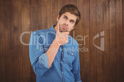 Thoughtful man with hand on chin