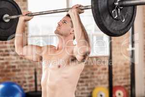 Muscular man doing weightlifting
