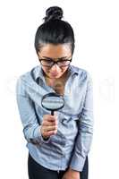 Woman examining with a magnifying glass