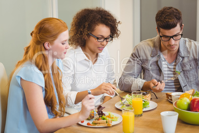 Business people having breakfast