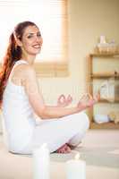 Portrait of smiling woman meditating