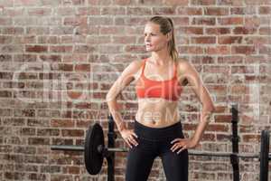 Portrait of serious fit woman looking at camera