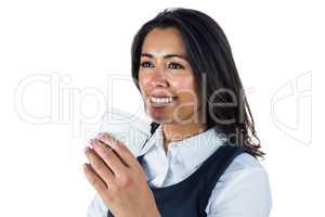 Smiling woman holding a paper cup